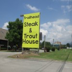 Sign @ Trailhead Steak & Trout House